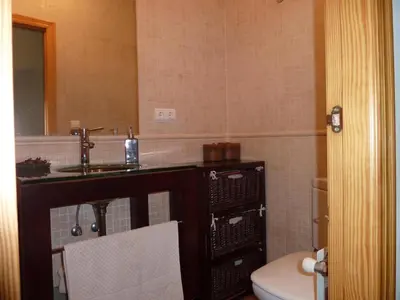 a bathroom with a sink and a toilet at Apartamento con encanto CORONA in Valencia
