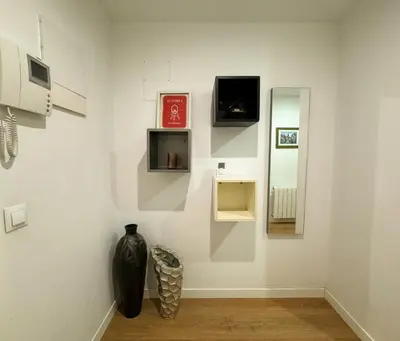 a black vase on a wall in a room at Luxury, design, relax, in historical street lift in Valencia