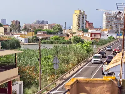 a view of a city with cars on a highway at CASA EN LA PLAYA VALENCIA EL PERELLO in Mareny Barraquetas