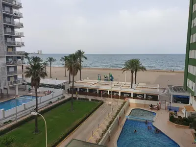 a view of the beach from a building with two pools at SingularStays Cullera IV in Cullera