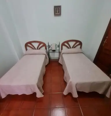 two beds sitting next to each other in a room at Casa Rural Los Pequeños (Monserrat) in Monserrat