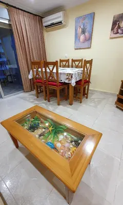 a room with a table and chairs and a table sidx sidx sidx at Piso familiar con amplia terraza 300m de la playa in Cullera
