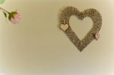 a pair of hearts hanging on a wall at Casa Bienvenida - Carcaixent in Carcagente
