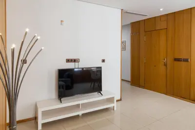 a living room with a flat screen tv on a white wall at Mercat Silence in Valencia