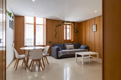 a living room with a couch and a table at Mercat Silence in Valencia