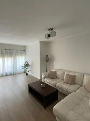 a living room with a couch and a coffee table at Jardines del Turia in Valencia