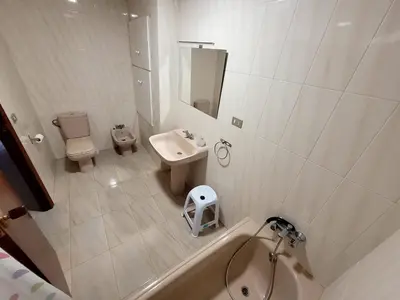 a bathroom with a tub and a sink and a toilet at CA LAU in Burriana