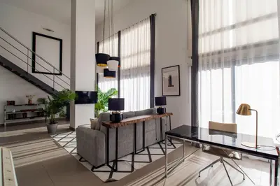 a living room with a couch and a table at MD Loft Valterna in Paterna