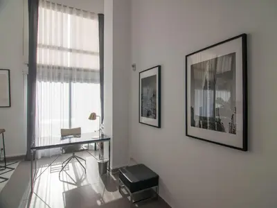 a white room with a desk and a window at MD Loft Valterna in Paterna