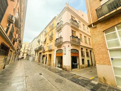 an empty street in a city with buildings at Duplex en el Carmen 1 in Valencia