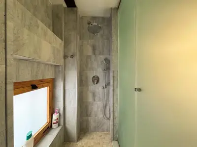 a bathroom with a shower with a glass door at Duplex en el Carmen 1 in Valencia