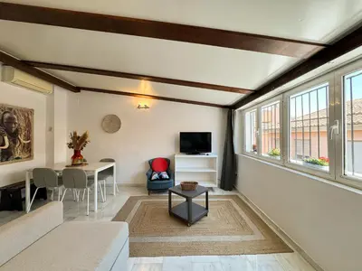 a living room with a couch and a table at Duplex en el Carmen 2 in Valencia