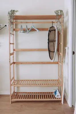 a ladder shelf in a closet with a tennis racket at Estelles D Apartment Close To Beach in Valencia