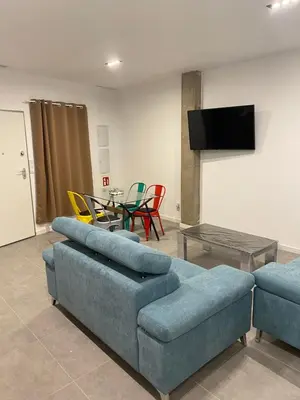 a living room with a couch and a table with chairs at Cantalar White in Anna