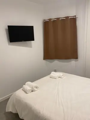 a bedroom with a bed with two towels on it at Cantalar White in Anna