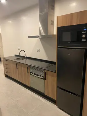 a kitchen with a black refrigerator and a microwave at Cantalar White in Anna