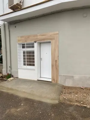 a garage with a white door and a window at Cantalar White in Anna