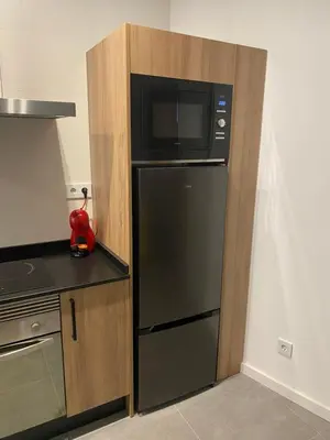 a kitchen with a black refrigerator and a microwave at Cantalar White in Anna