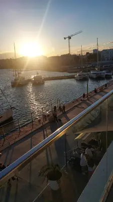 a boat in the water with the sun setting at Lyesblb in Valencia
