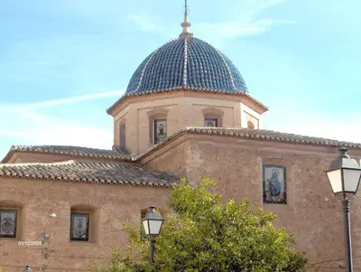 a building with a blue dome on top of it at Apartamentos Rurales San Juan in Castellnovo