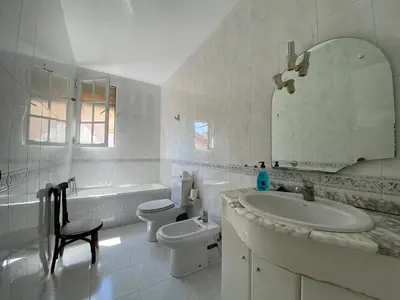 a white bathroom with a sink and a toilet at BIGGER FLAT IDEAL PARA FAMILIA NEAR CENTER AND BEACH in Valencia