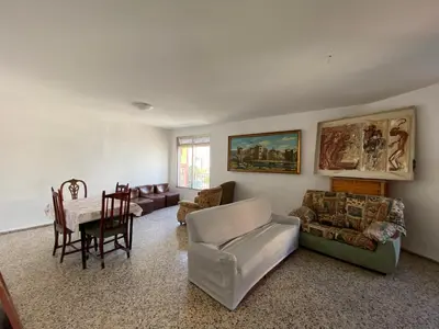 a living room with a couch and a table at BIGGER FLAT IDEAL PARA FAMILIA NEAR CENTER AND BEACH in Valencia