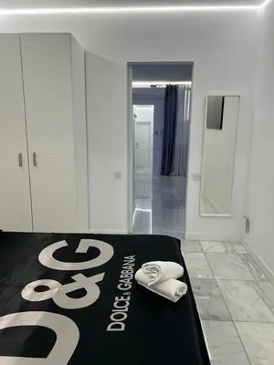 a hotel room with a bed with towels on it at DeLuxe House Valencia in Valencia
