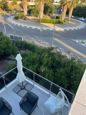 a balcony with a table and chairs and an umbrella at DeLuxe House Valencia in Valencia