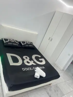 a bag of dog food sitting on a bed at DeLuxe House Valencia in Valencia