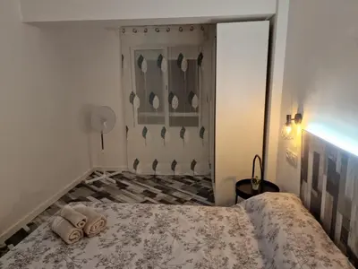 a bedroom with a bed in a room with a closet at Selena Beach in Cullera