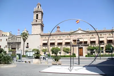 a large building with a clock tower in the background at City Centre Room in Valencia