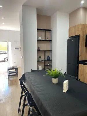 a table with a plant on it in a room at UIM Mediterraneo PB Luis Vives Wifi in Puerto de Sagunto