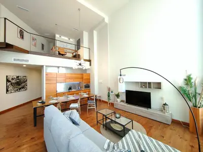 a living room with a couch and a table at The Luxury Apartment in Valencia