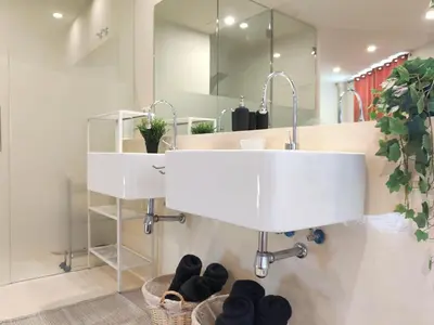 a bathroom with a sink and a mirror at The Luxury Apartment in Valencia
