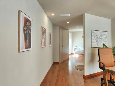 a hallway with a dining room and a living room at The Luxury Apartment in Valencia
