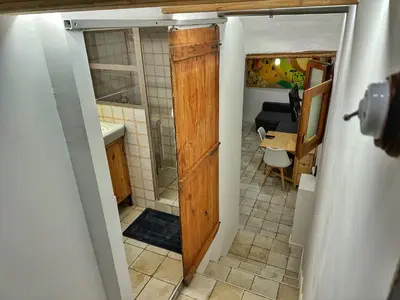 an open door to a kitchen with a bathroom at Dulces Sueños Pilar in Valencia