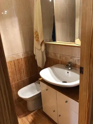 a bathroom with a sink and a toilet at Acogedor apartamento en el grau de Moncofa con wifi in Moncófar