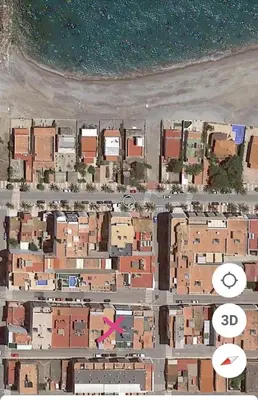 a map of a city with buildings and a pink arrow at Acogedor apartamento en el grau de Moncofa con wifi in Moncófar