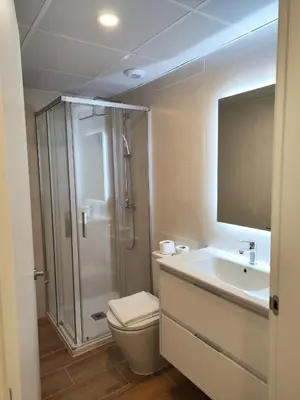 a bathroom with a shower and a toilet and a sink at TOP DUPLEX NUEVO A ESTRENAR ,CIUDAD DE LAS CIENCIAS in Valencia