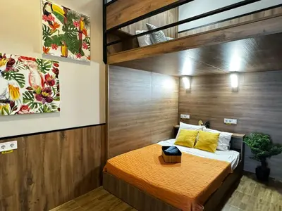 a bedroom with a bed with a wooden wall at Lliri 32 in Valencia