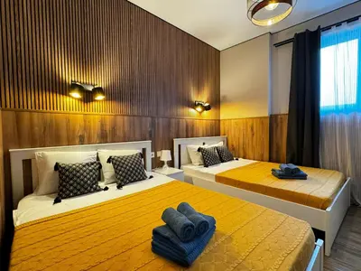 two beds in a room with two blue towels on them at Lliri 32 in Valencia
