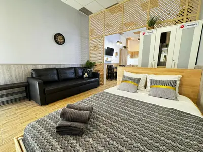 a bedroom with a large bed and a couch at Salom 5 in Valencia