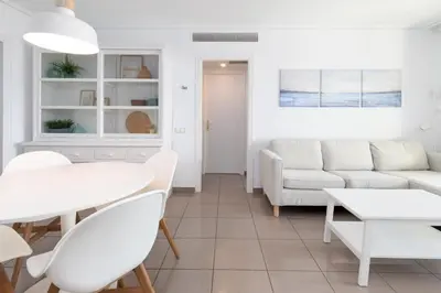 a living room with a couch and a table at Patacona Breeze in Valencia