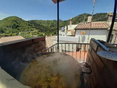 a fire pit on the balcony of a house at ÁTICO RURAL 