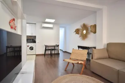 a living room with a couch and a table at Gran piso en barrio historico del centro in Valencia