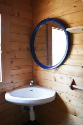a bathroom with a white sink and a mirror at Retiro Siete Aguas in Siete Aguas