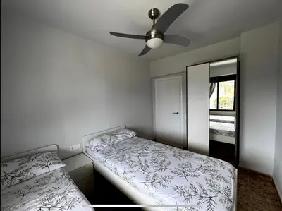 a bedroom with a bed and a ceiling fan at Beach Retreat in Valencia
