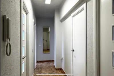 a hallway with a door and a mirror in a room at Beach Retreat in Valencia