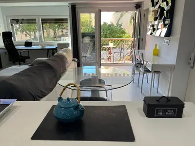 a living room with a couch and a glass table at Plaza del Carmen Boutique in Valencia