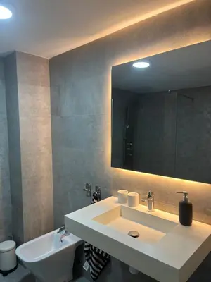 a bathroom with a sink and a mirror at Plaza del Carmen Boutique in Valencia